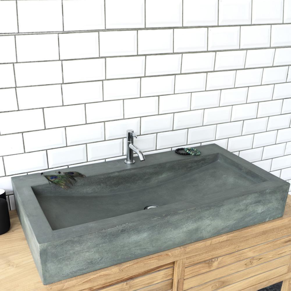 concrete sink on wood bathroom vanity